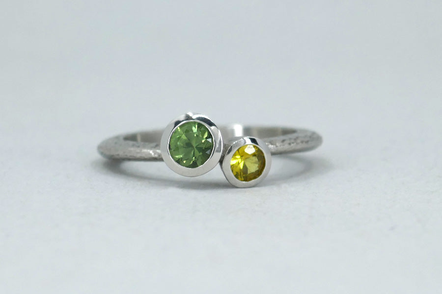 Quirky Two Stone Green & Yellow Sapphire Platinum Ring