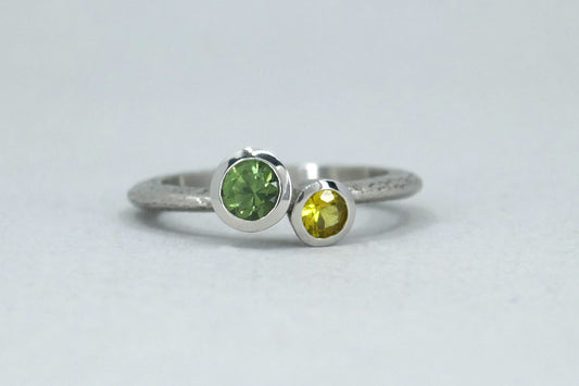 Quirky Two Stone Green & Yellow Sapphire Platinum Ring