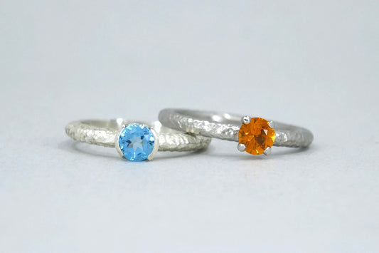 Blue Topaz & Orange Sapphire Solitaire Silver & Platinum Rings