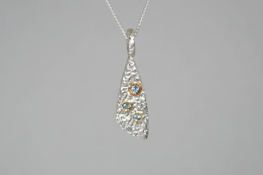 Burr Design Silver & 18ct Gold Blue Topaz Pendant