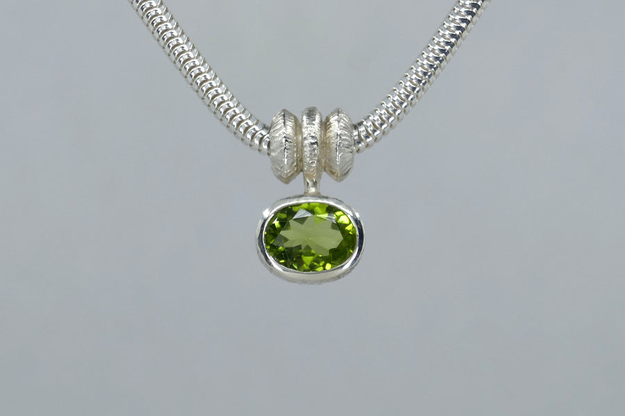 Oval Peridot Triple Bead Design Silver Necklace