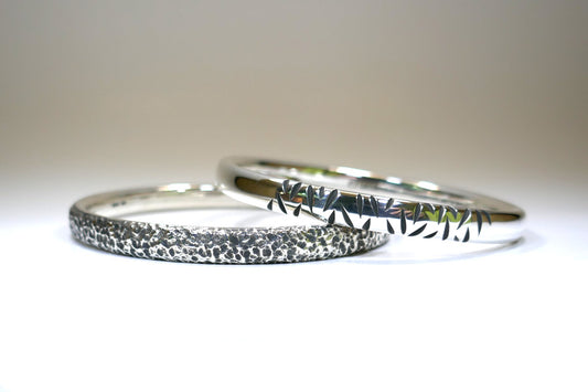 Burred & Notch Pattern Oval Section Silver Bangles